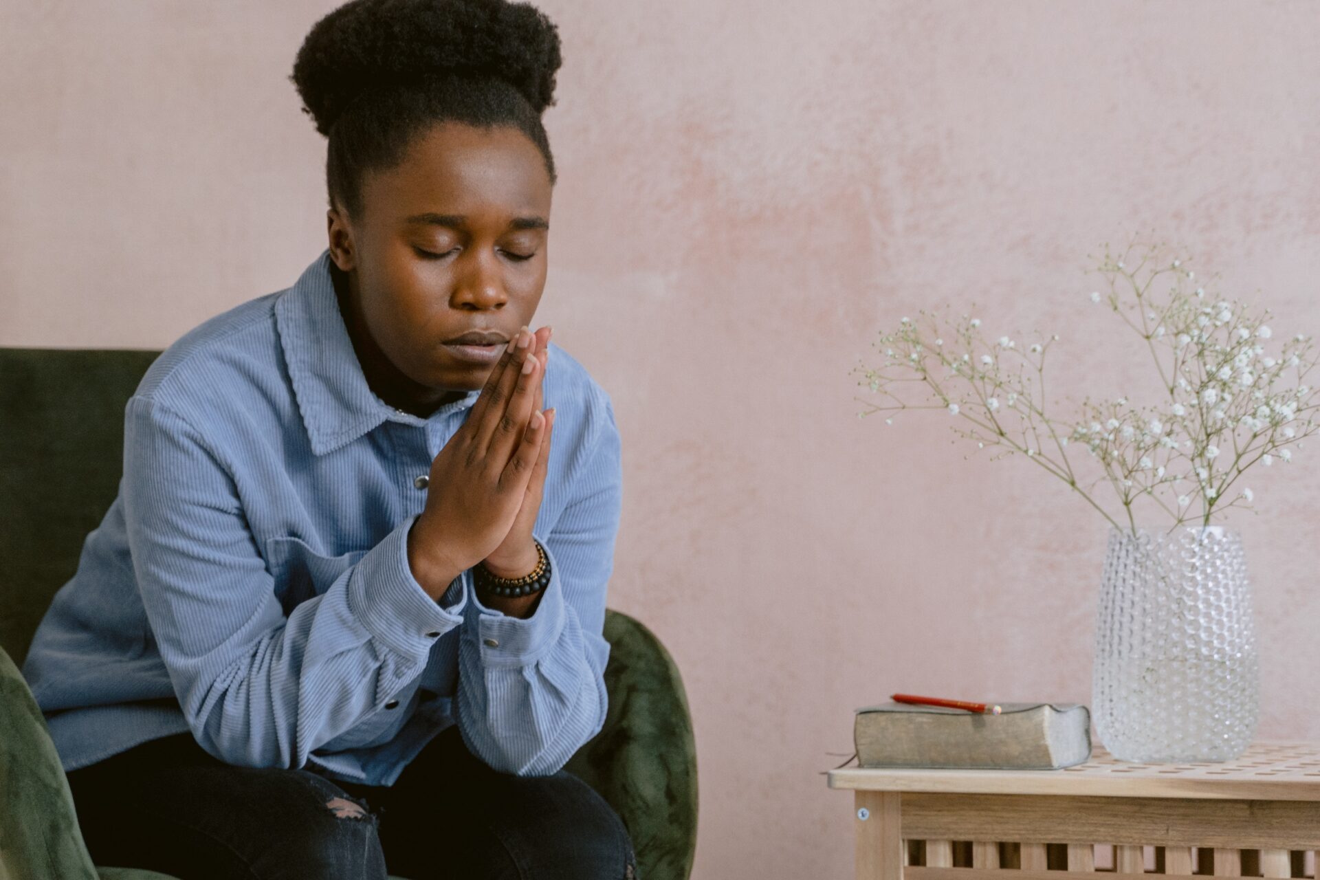 Woman in Blue Dress Shirt Praying