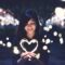 A woman holding a heart